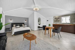 a bedroom with a bed and a living room at Spacious Villa Victoria Heated Pool in Callao Salvaje