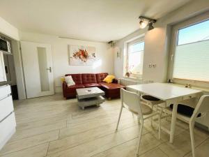 a living room with a couch and a table at Ferienhaus "Christin" Objekt-ID 15689-2 in Waren
