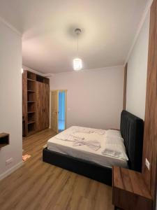 a bedroom with a bed in a room at Gwin Hotel in Fier