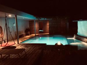 a large swimming pool in a dark room with at Tiny House Hubert von Auernheim in Treuchtlingen