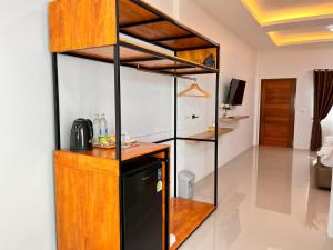a kitchen with a bunk bed in a room at Aten hotel in Sathani Khao Pip