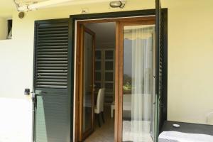 a glass door leading into a room with a window at Pian di luna in Sarzana +49 photos