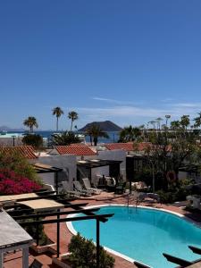 a view of a swimming pool at a resort at La Concha del Mar in Corralejo