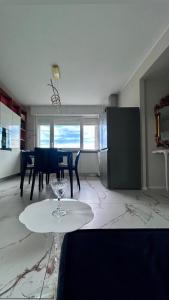 a living room with a table and a dining room at Camera da letto in Angolo di Pace in Grugliasco