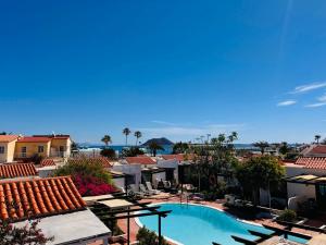 a view of a resort with a swimming pool at La Concha del Mar in Corralejo