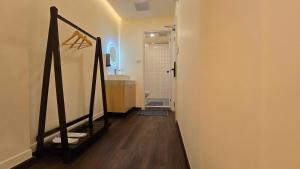 a hallway with a staircase leading to a bathroom at Norns Silom Cafe & Stay in Bangkok +38 photos
