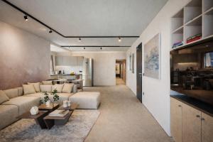 a living room with a couch and a table at Nerea Residences in Schinias