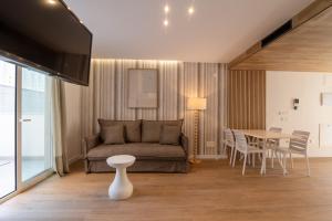 a living room with a couch and a table at Letplanet Playa Park in Torremolinos