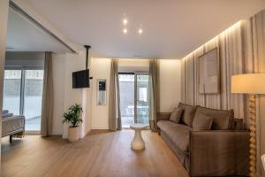 a living room with a couch and a table at Letplanet Playa Park in Torremolinos