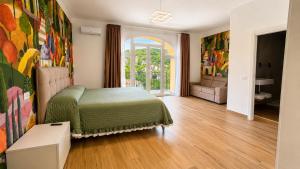 a bedroom with a bed and a living room at B&B Venere Rooms in Pimonte