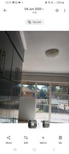 a picture of a room with a laptop and a window at Elikia in Pretoria