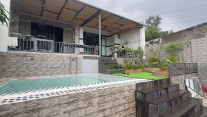 a house with a swimming pool in a yard at sunnyhome 2 wide spaces in Ấp Ðại Tài (2)