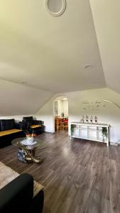a living room with a couch and a table at Secret Paradise apartment in Zgornje Gorje