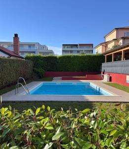 a swimming pool in the middle of a yard at Novigrad Garden Apartment in Novigrad Istria