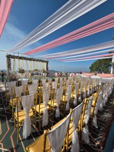 a row of chairs for a wedding ceremony at Barog Heights in Barog