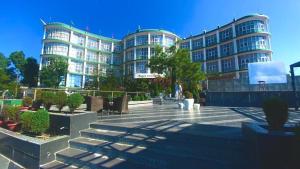 a large apartment building with stairs in front of it at Barog Heights in Barog