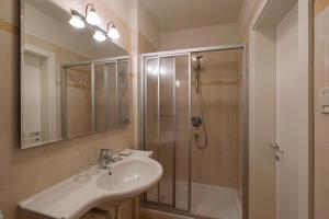 a bathroom with a sink and a shower at Panorama Hotel St Georgen in Schenna +34 photos