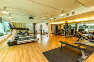 a gym with treadmills and machines in a room at LiT BANGKOK Hotel in Bangkok +123 photos