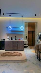 a living room with a sink and a couch at فلة جديدة راقية بمسبح داخلي Luxury villa with indoor pool in Taif