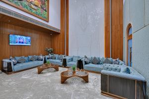 a lobby with couches and tables in a building at Ira by Orchid Dwarka in Dwarka +53 photos