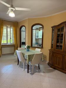a dining room with a table and chairs at Demetra Apartment Sperlonga in Sperlonga