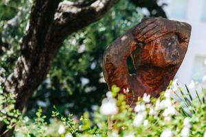 a tree trunk with a hole in it at Hotel Ariston in Bibione