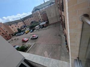 an aerial view of a parking lot with cars at Cosy Centre in Dundee