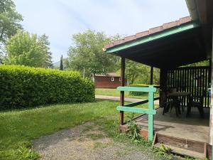 a blue shelf in the yard of a house at Camping Onlycamp Les Bords de Lyonne in Saint-Jean-en-Royans