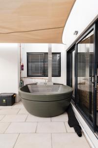 a bathroom with a large tub in the middle at Hole Inn 1 in Robertson +33 photos