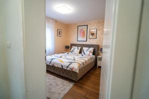 a bedroom with a bed in a room at Villa Bella in Mostar +49 photos