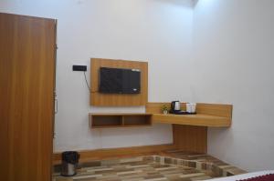 a room with a flat screen tv on a wall at Hotel Vijanta Banquet in Sasarām