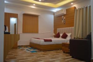 a bedroom with a bed and a television in it at Hotel Vijanta Banquet in Sasarām +20 photos