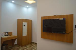 a room with a flat screen tv on a wall at Hotel Vijanta Banquet in Sasarām