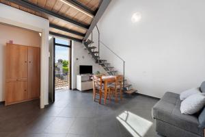 a living room with a couch and a table at La Casa Di Lillo - Angera in Angera +19 photos