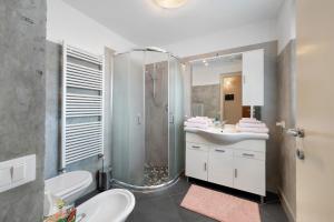 a bathroom with a shower and a sink and a toilet at La Casa Di Lillo - Angera in Angera