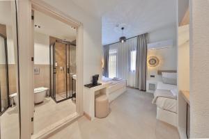 a bathroom with a shower and a toilet and a sink at yazz inn in Kaş