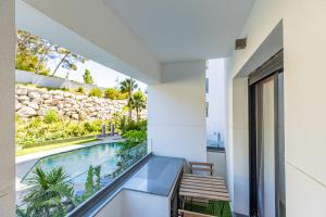 a house with a swimming pool and a balcony at Seaside Pool View 3BR Apt with 2 Balconies in Tangier +43 photos
