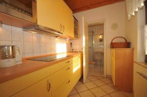 a kitchen with a sink and a counter top at Ruegen_Fewo 233 in Groß Zicker +42 photos