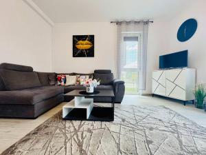 a living room with a couch and a coffee table at Joy City Stay Lavandei 2 in Timişoara