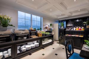 a kitchen with a counter with some food at Sapa Boutique Hotel & Spa in Sapa +18 photos