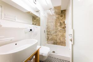 a bathroom with a sink and a shower at Grgur Ninski Rooms in Split