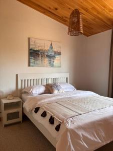 Katil atau katil-katil dalam bilik di Oceanfront Apartments