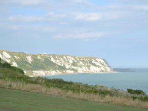 a view of the ocean and white cliffs at The Barn At Fishponds in Brook +4 photos