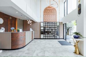 a lobby of a building with a reception desk at ABC@48 Hotel & Service Apartment in Bangkok