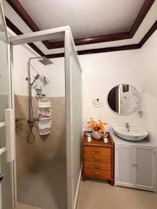 a bathroom with a sink and a mirror at Rose Haven Staycation Panabo in Panabo +5 photos