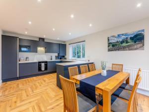 a kitchen and dining room with a table and chairs at The Bunker - Uk47763 in Bamburgh