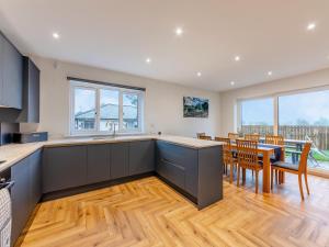 a kitchen and dining room with a table and chairs at The Bunker - Uk47763 in Bamburgh