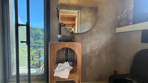 a bathroom with a sink and a mirror at Mourulle in Insúa +44 photos