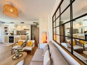 a living room with a couch and a table at Moraira Castle Boutique Apartment in Moraira