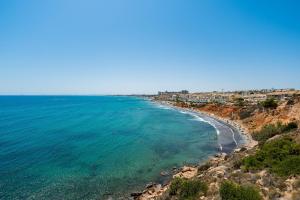 a view of the beach in positano on the amalfi coast at Aguamarina 2 Sunrise in Orihuela